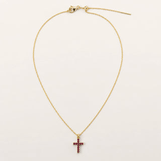 Collar Cruz: cadena fina dorada con dije de cruz.
