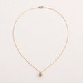 Collar Semilla: cadena muy fina con dije pequeño e irregular.